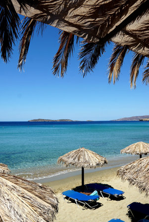 A vertical shot of umbrellas on the beachの写真素材