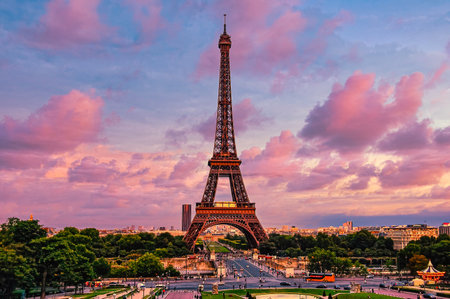 The Eiffel Tower against a mesmerizing pink cloudy sky in Paris, Franceの写真素材