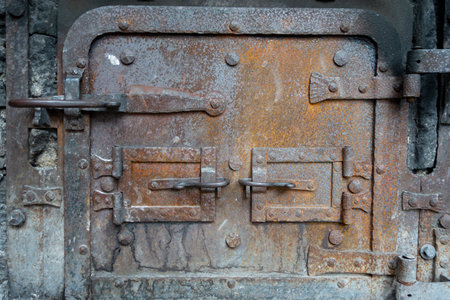 A close up of a rusty old aged metal doorの写真素材