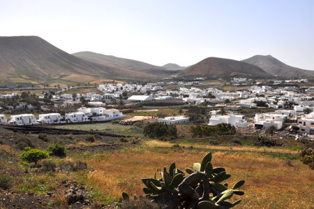 View over village on spanish volcanic island Lanzarote, Spainの写真素材