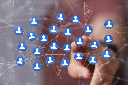 A businessman tapping on 3D rendered interconnected people - global networking and connection conceptの写真素材