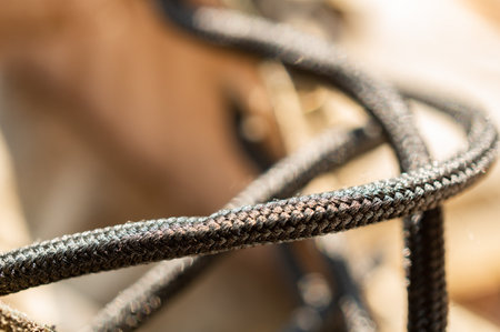 A macro shot of shoelaces in sunlight with bokeh lights