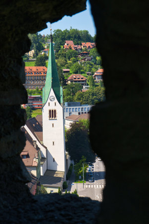 A view of a church on Bled Lake from behind the wall in Slovenia, Europeの写真素材