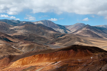 A beautiful view of many small mountains with a blue sky backgroundの写真素材
