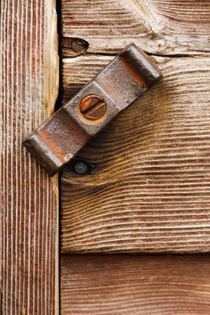 A vertical shot of a wooden door during the daytimeの写真素材