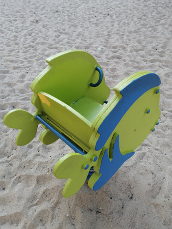 A yellow spring rider on the kid playgroundの写真素材