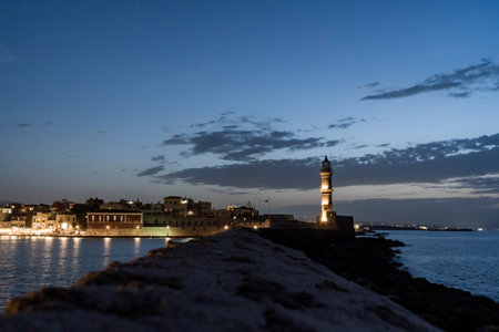 A scenic view of an old lighthouse during nighttimeの写真素材