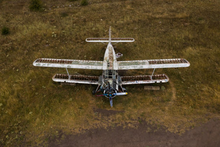 An old abandoned small airplane in the field