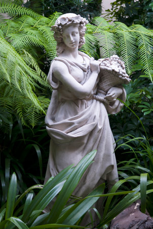 Sculpture of woman in tropical garden, art expression in exterior guatemala.の写真素材