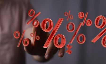 A person presenting the virtual projection of percent signs - sale or discount conceptの写真素材