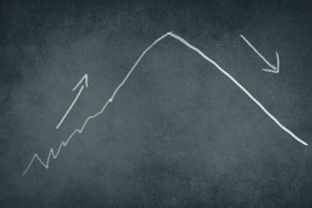 Presentation in a curve on a blackboard, drawing with chalk, inflation, increasing and falling curveの写真素材