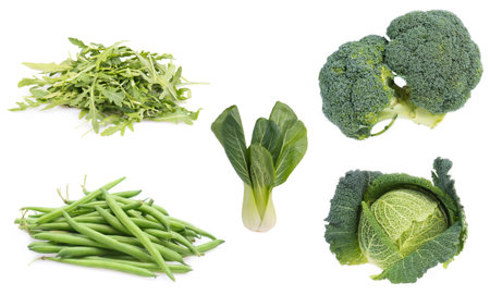 A view of different healthy vegetables and ingredients on a white backgroundの写真素材