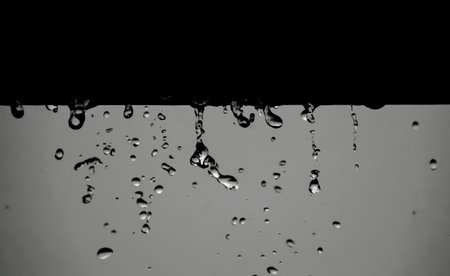 A beautiful shot of water drops on a gray background