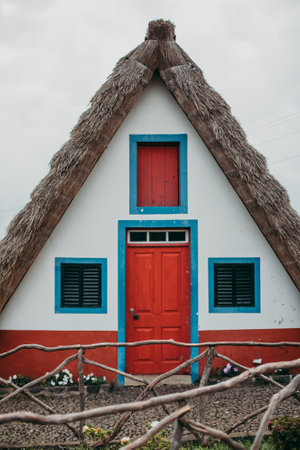 A vertical shot of a traditional rural house in Santana in Portugalの写真素材