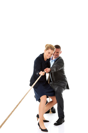 A vertical shot of businessman and woman supporting each other isolated on white backgroundの写真素材