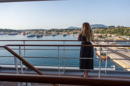 A blonde woman enjoying the views of the oceanの写真素材