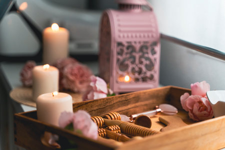 Aromatic candles and a set of wooden tools for massageの写真素材