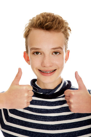 The portrait of a young boy with the white backgroundの写真素材