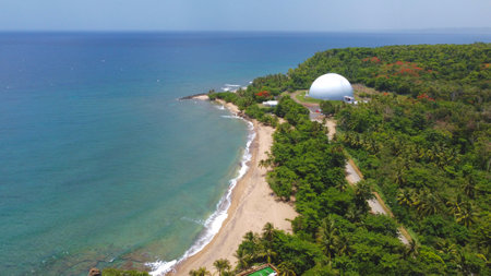 A landscape of the Domes Beach covered in greenery in Puerto Rico