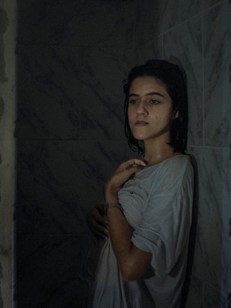 A vertical shot of a white Caucasian girl posing for a pictureの写真素材