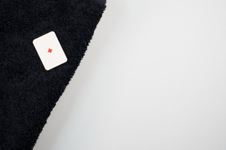 A closeup shot of a diamond card on a black carpetの写真素材