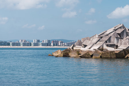 A beautiful shot of a sea with the town in the backgroundの写真素材
