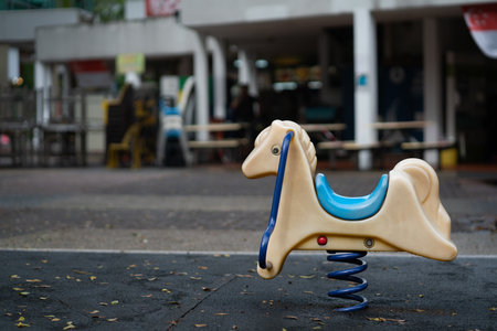 A horse carousel for children outdoorsの写真素材