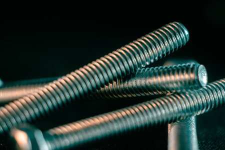 A pile of screws on a black backgroundの写真素材