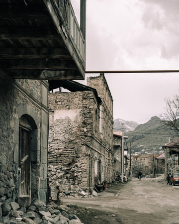 A vertical shot of old ruined buildings in Gyumri, Armenia in dim colorsの写真素材