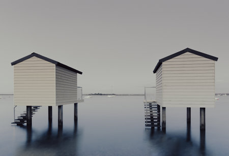 A long exposure shot of the Beach Huts in Osea, Essex, United Kingdomの写真素材