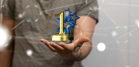 A 3D rendering of a first place golden award and male hand holding on a blurry backgroundの写真素材