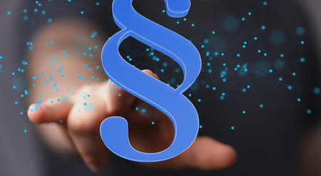 A 3d rendering of a hand reaching a blue law paragraph symbol over tiny dotsの写真素材