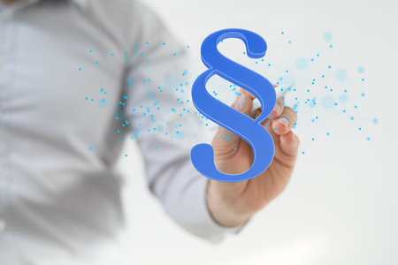 A 3d rendering of a blue law paragraph symbol touched by a hand on a white backgroundの写真素材