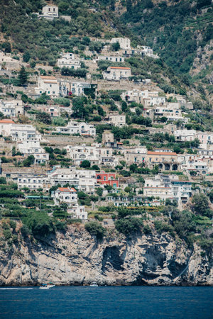 A vertical shot of houses on the cliff in Amalfi, Italyの写真素材
