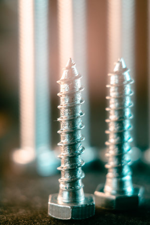 A pile of screws on a blurred backgroundの写真素材