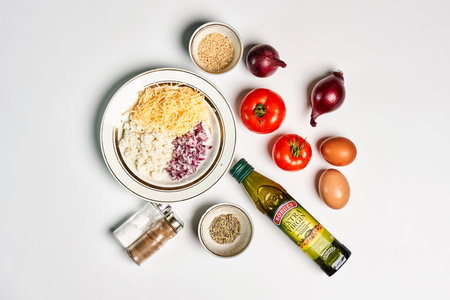 An ingredients for cooking a delicious meal on a white tableの写真素材