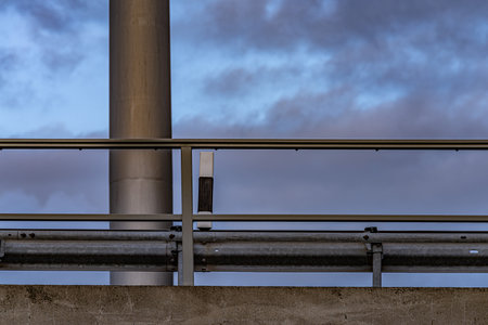 A tranquil scenery of a metallic structure on the roof of a building on a gloomy day