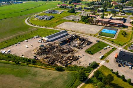 Aerial drone view around burnt down warehouse building ruinsの写真素材