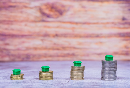 A closeup of coin stacks as a concept of rising real estate prices