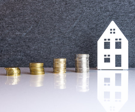 A closeup of coin stacks as a concept of rising real estate pricesの写真素材