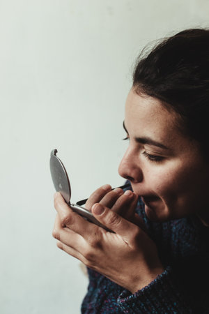 An Uruguayan woman doing makeupの写真素材