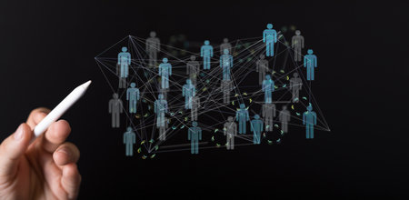 A 3D rendering of human icons floating beside a hand holding a pen- digital work conference conceptの写真素材