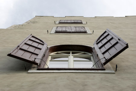 Low angle view of brown shutters on Italian house, Provide of Triesteの写真素材