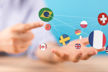 A 3D rendering of the world's flags and a male hand holding smartphoneの写真素材