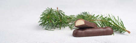 Marzipan bread, typical german christmas sweets called Marzipanbrot with a twig og a fir tree