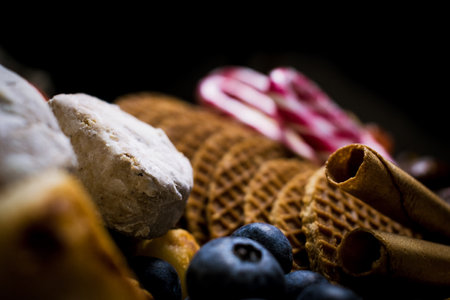 A soft focus of wafers and other sweets on d