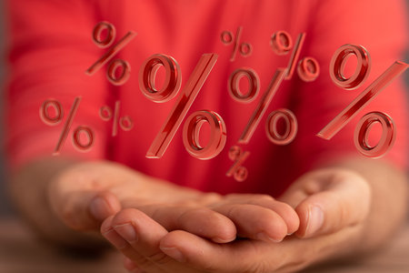 A person presenting 3D rendered percent icon representing the concept of sale and discountの写真素材