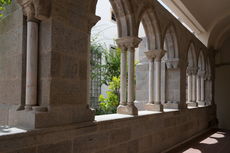 A beautiful shot of arches in an old, historical building in Evora, Portugalの写真素材