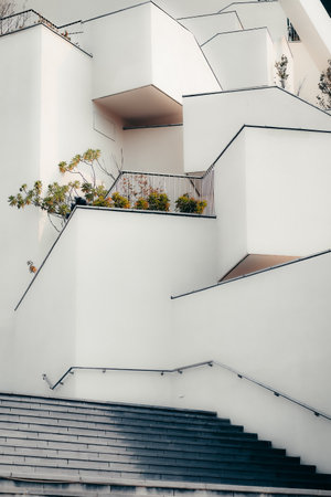 An abstract building with geometric balconies near the stairsの写真素材