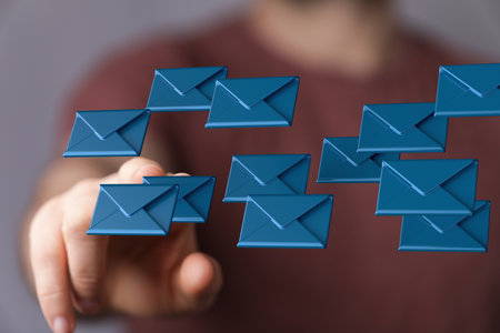 A man tapping on 3D rendering of envelopes - email, online messaging conceptの写真素材